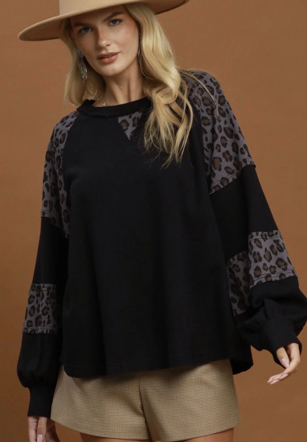 Leopard Mix Thermal Top: black, long-sleeve shirt with leopard print accents on shoulders and sleeves. Available in sizes XS–XL.
