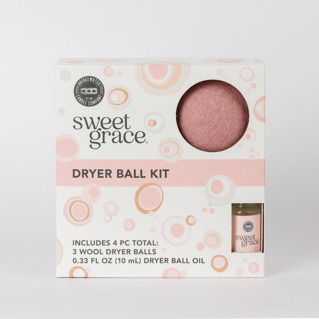 Dryer Ball Kits Sweet Grace: 3 wool dryer balls, fragranced laundry oil, white box with pink/orange accents. Sizes not shown.