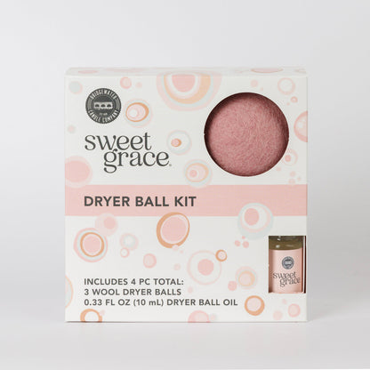 Dryer Ball Kits Sweet Grace: 3 wool dryer balls, fragranced laundry oil, white box with pink/orange accents. Sizes not shown.