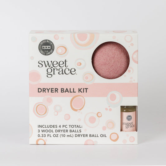 Dryer Ball Kits Sweet Grace: 3 wool dryer balls, fragranced laundry oil, white box with pink/orange accents. Sizes not shown.