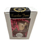 A white box with a clear window displaying several car diffusers and pink shredded packing material. The top features a black label with "Everlee Jane" and a gold laurel wreath with the letter "E." Another label reads "Meringue Treasures." Available sizes: Standard.