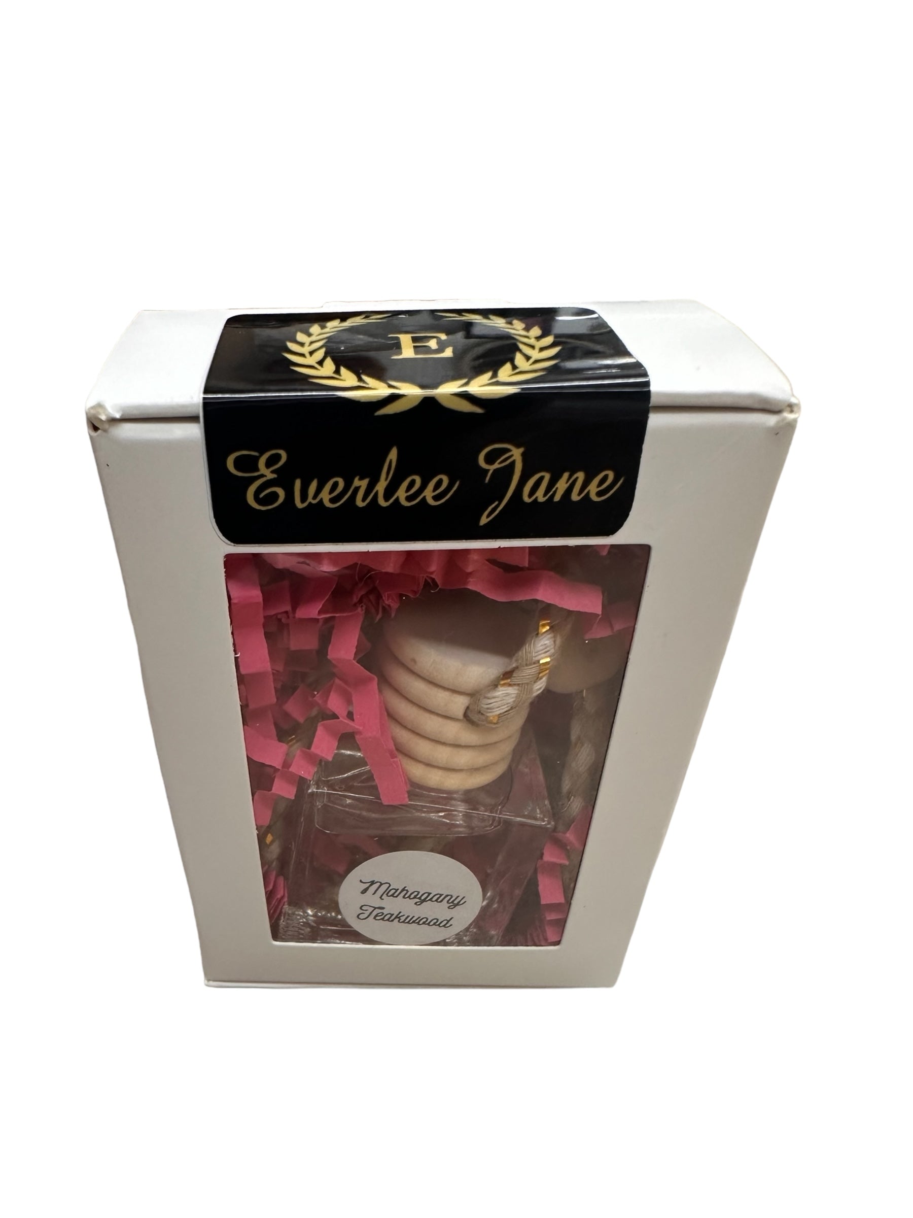 A white box with a clear window displaying several car diffusers and pink shredded packing material. The top features a black label with "Everlee Jane" and a gold laurel wreath with the letter "E." Another label reads "Meringue Treasures." Available sizes: Standard.