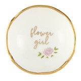 Small white dish with gold rim, “flower girl” in gold, pink flower with green leaves. Size: small.