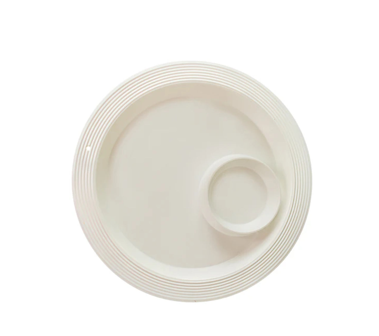 The Chip and Dip Platter Pinstripes is a circular, beige melamine platter with a smaller compartment on the right side. It features a subtle striped texture on the outer edge, blending durability with minimalist style for outdoor use. Available in one size.