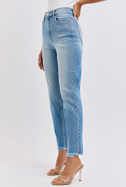 Distressed High Rise Mom Jeans with raw, frayed hem. Available in sizes 24–32.