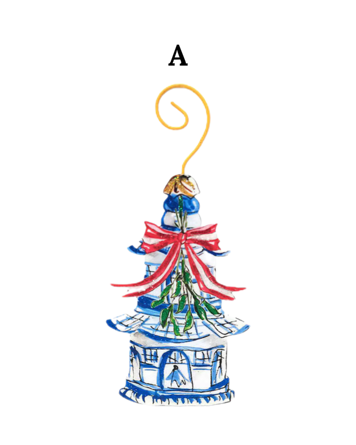Beck’s Chinoiserie blue and white pagoda ornament with a red bow and mistletoe.