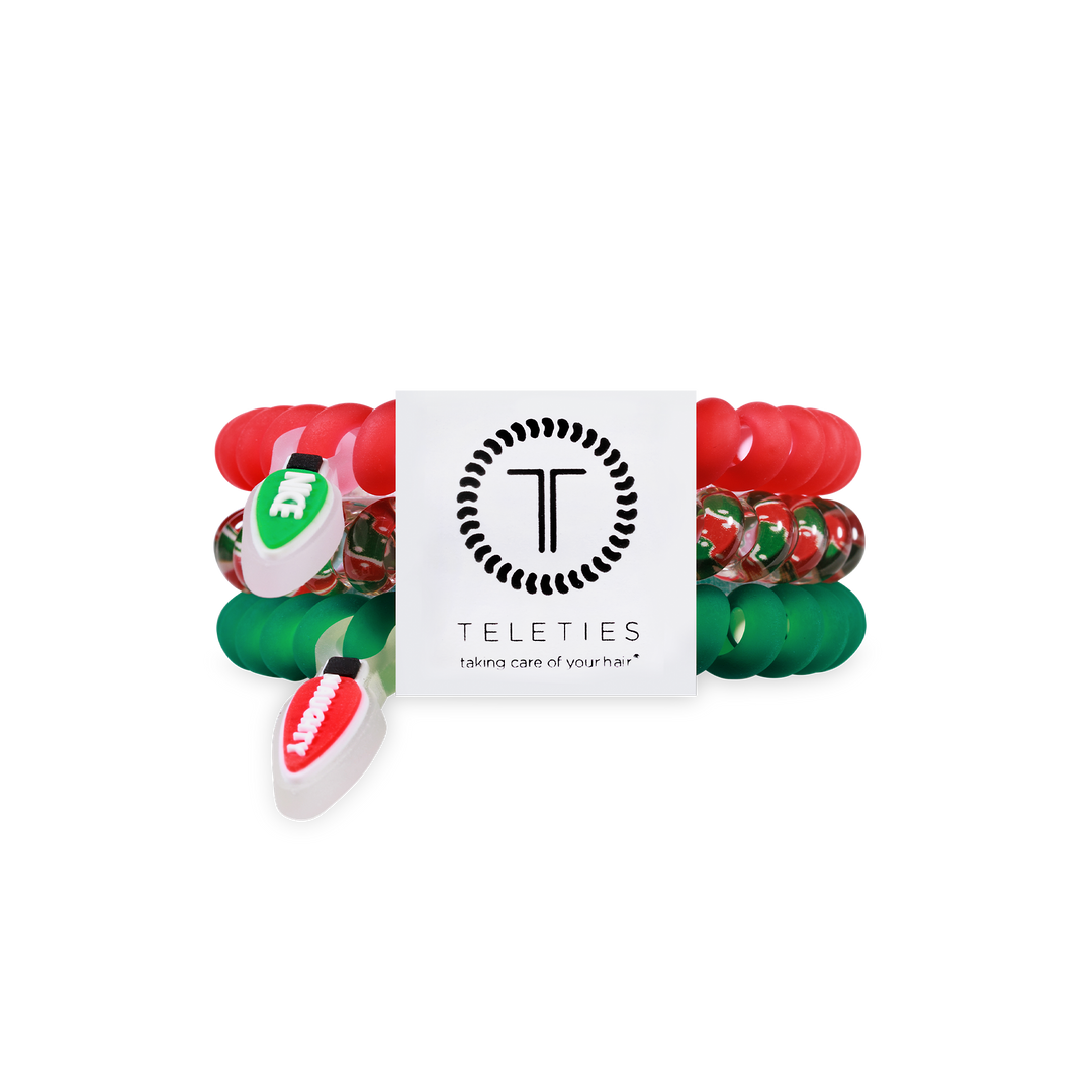 Three small spiral hair coils in red and green with festive charms. Secure hold, snag-free. Size: Small.