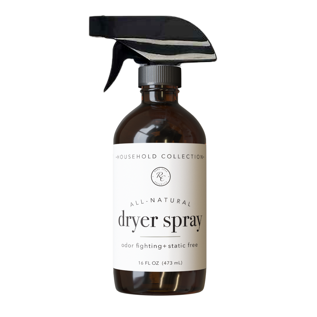Brown bottle with black spray nozzle labeled “DRYER SPRAY | 16 oz”; natural, odor-fighting fabric softener; available in 16 oz.