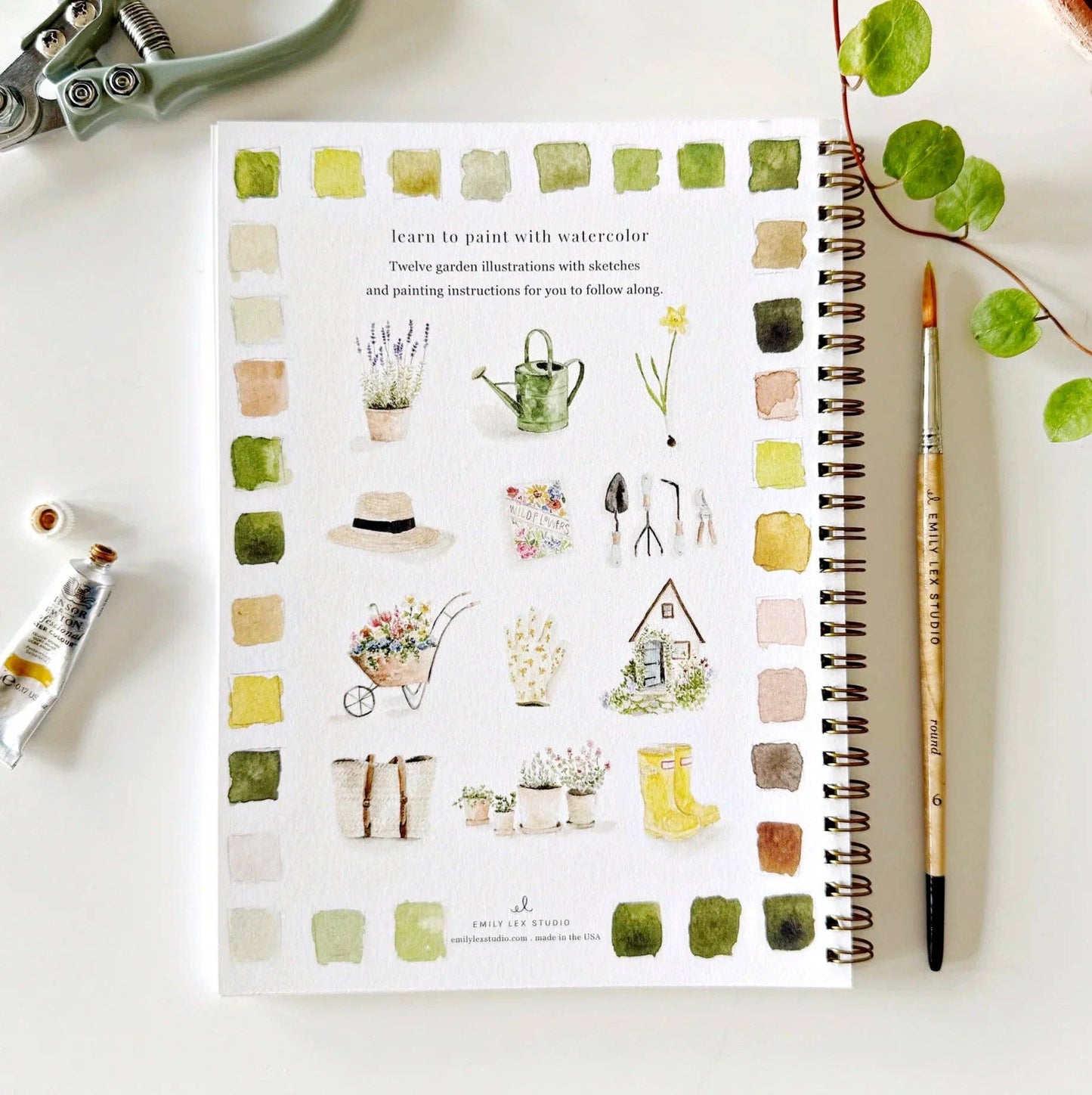 The Garden Watercolor Workbook, spiral-bound with garden art, instructions, and color swatches on cover. Available in multiple sizes.