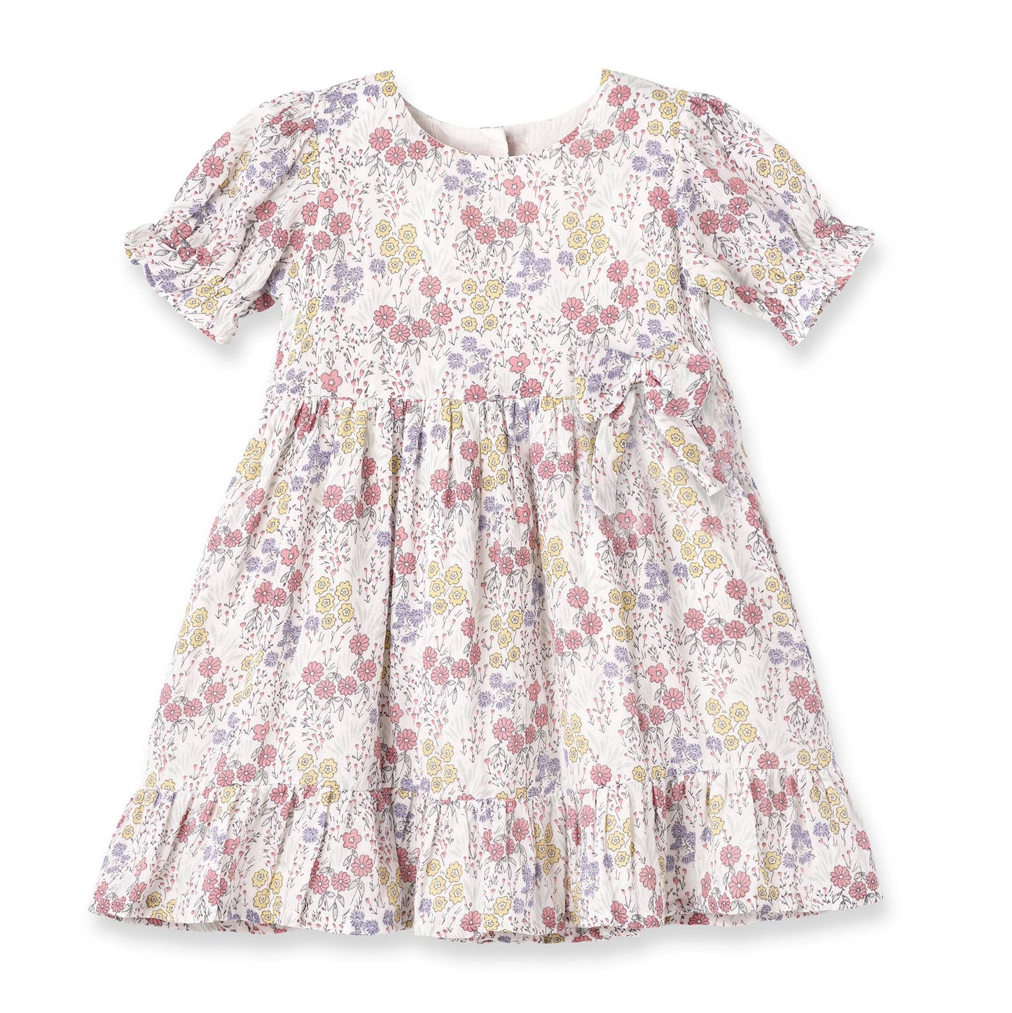 White cotton dress with pink, yellow, purple floral print, puff sleeves, gathered waist, ruffled hem. Sizes: 0-6 years.