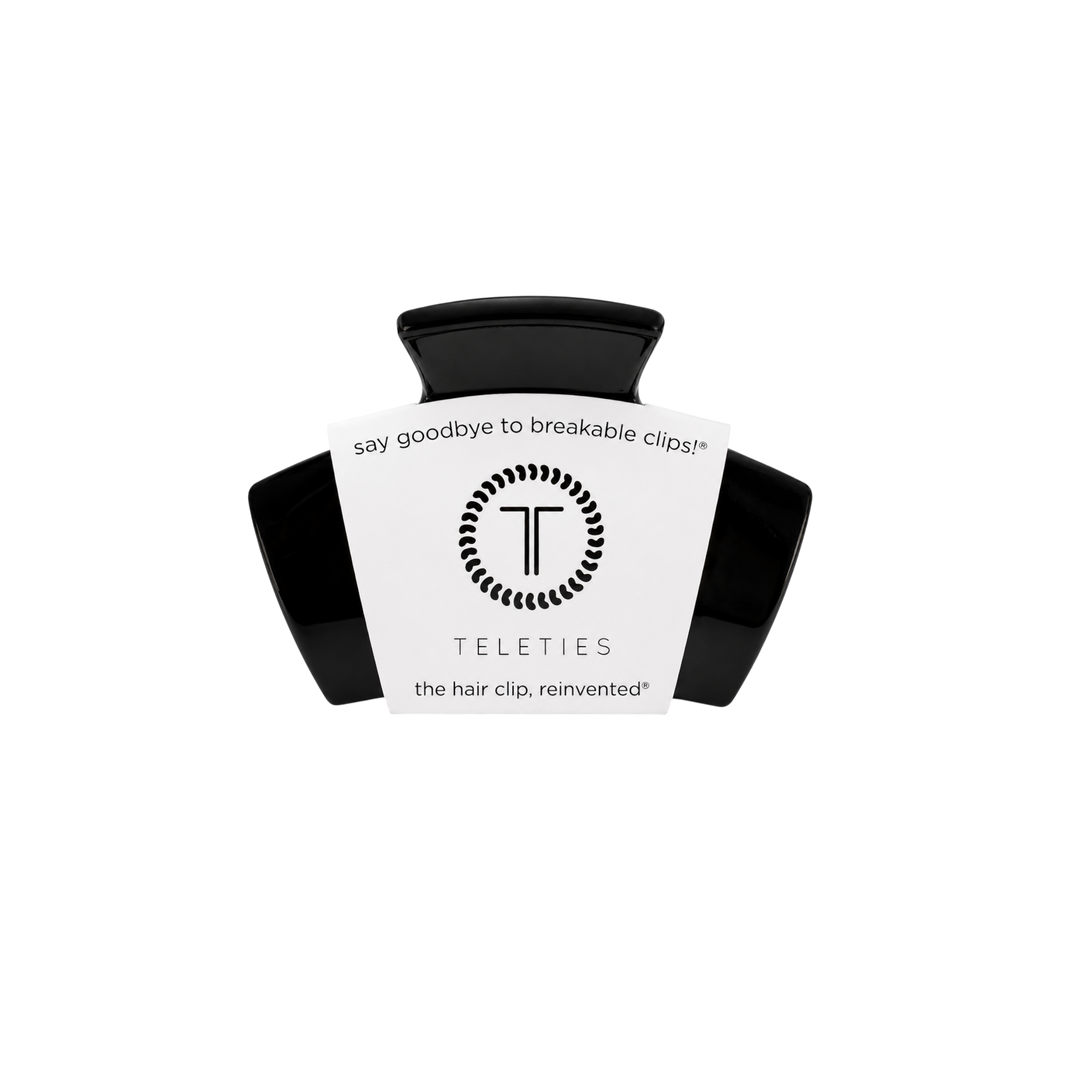 Jet Black Petite Claw Clip from TELETIES with a white label stating “say goodbye to breakable clips! TELETIES the hair clip, reinvented.” No-slip design for secure, comfortable all-day wear. Available sizes: Petite.
