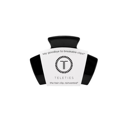 Jet Black Petite Claw Clip from TELETIES with a white label stating “say goodbye to breakable clips! TELETIES the hair clip, reinvented.” No-slip design for secure, comfortable all-day wear. Available sizes: Petite.