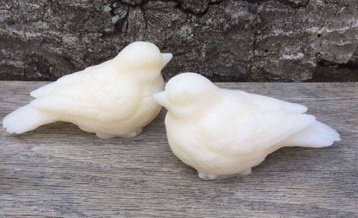 Two white bird-shaped Sweet Birdy Guest Soaps, gardenia scented, gentle and moisturizing. Available in two sizes.