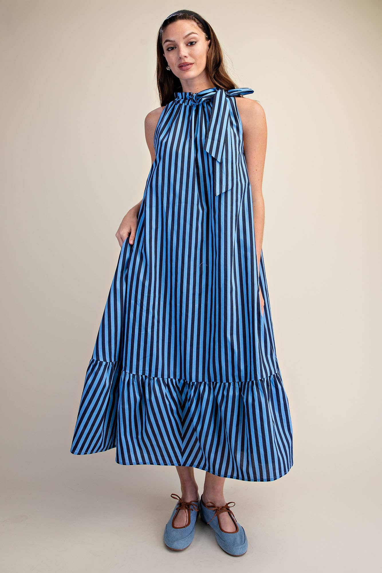 Stripe Midi Dress With Sleeveless Ruffle Neck Tie in navy with black stripes, bow neckline, ruffle hem. Sizes: XS-XL.
