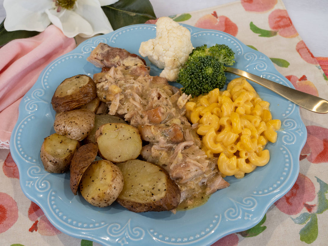 Country Ranch Porkchops in gravy on a blue plate. Sizes available: Small, Medium, Large.
