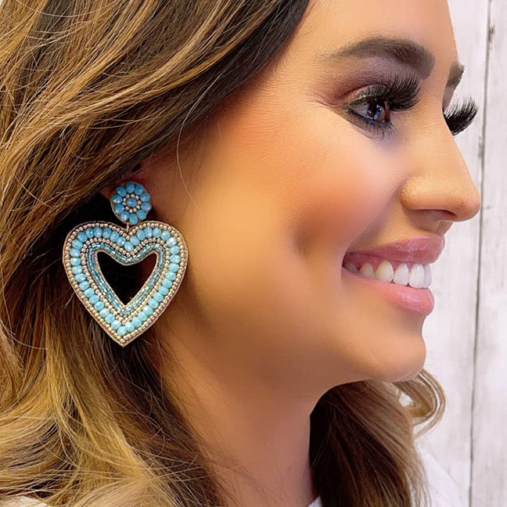 Blue Heart Earrings with seed beads and floral accent at top; available in small, medium, and large sizes.