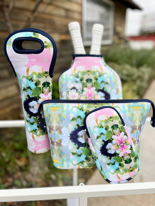 Nantucket Bloom Pickleball Paddle Cover in abstract floral print with pocket, blue trim. Sizes: standard, extra.