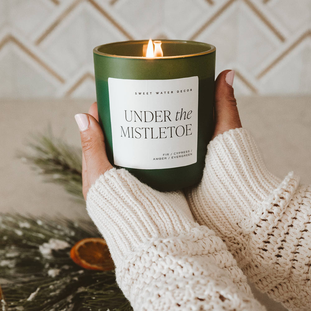Under the Mistletoe 15 oz Soy Matte Candle in a green jar.