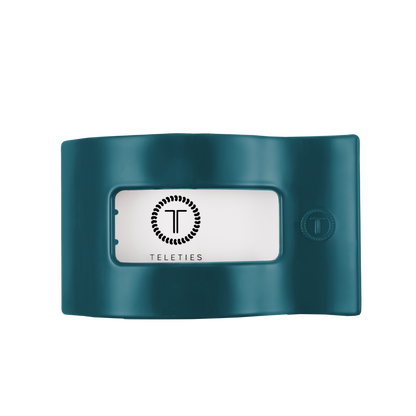 Teal flat rectangle hair clip with a clear window displaying the TELETIES logo; available in large size.