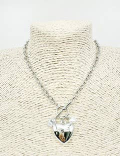 The Cua Silver Necklace has a shiny heart pendant, toggle clasp, silver link chain. Available in 16", 18", and 20" sizes.
