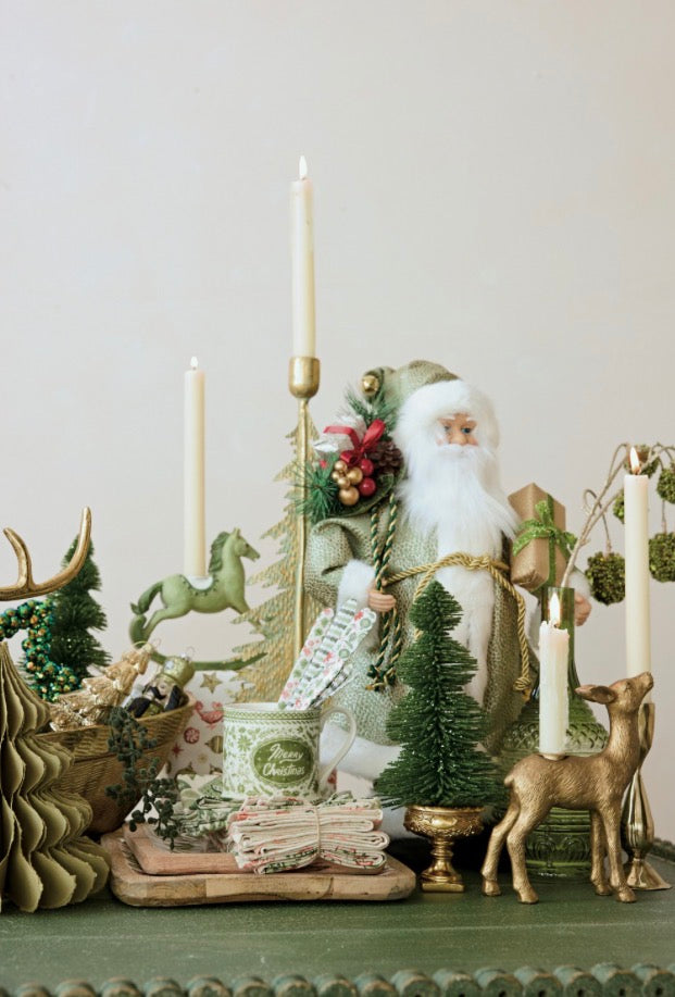 Green glitter bottle brush tree on a gold pedestal base.