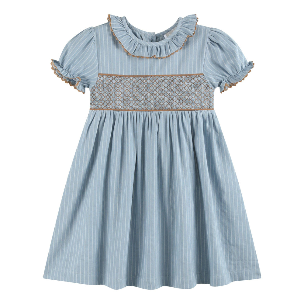 Light blue short-sleeved dress with vertical white pinstripes, smocked chest, ruffled collar, and brown trim on the collar and puffed sleeves. Size available: 12-18M.