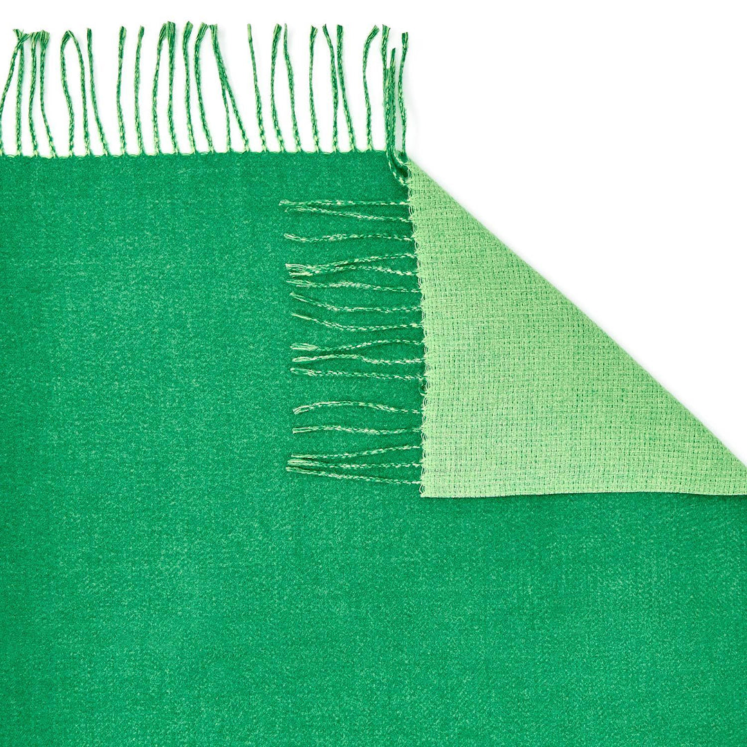 Reversible Scarf with soft cashmere-like texture, lighter green underside, chic fringe. Available in S, M, and L.