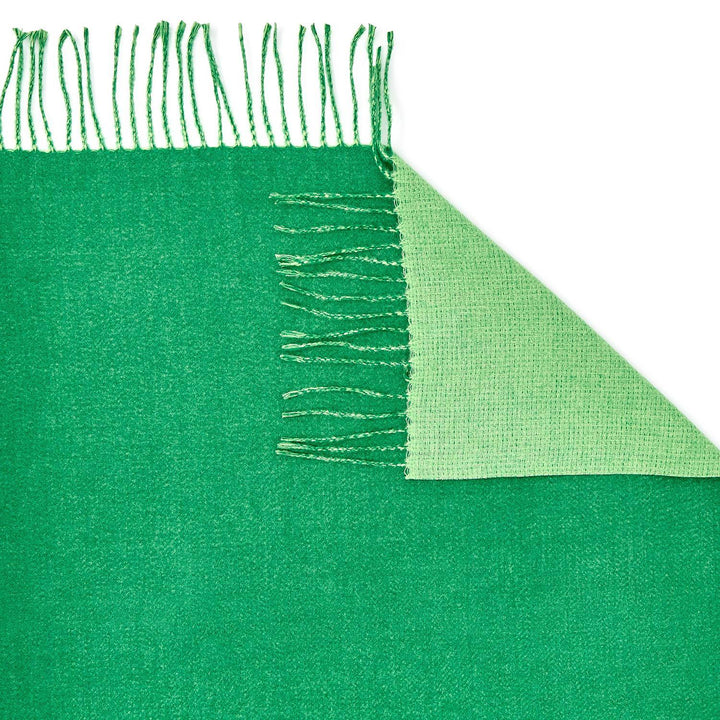 Reversible Scarf with soft cashmere-like texture, lighter green underside, chic fringe. Available in S, M, and L.