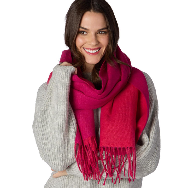 Reversible Scarf in bright pink with fringed ends, available in S, M, and L. Cozy material.