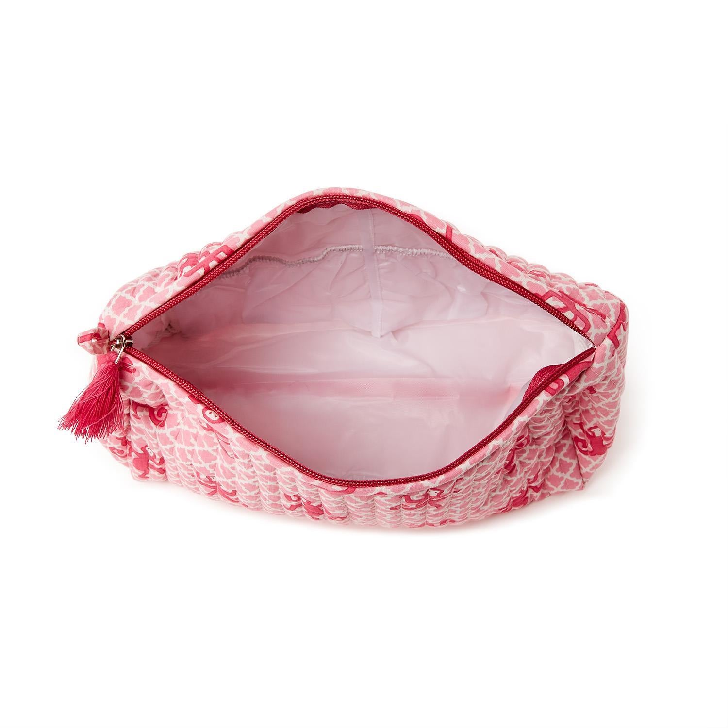 Block printed cosmetic bag with tassel zipper, light roomy interior, available in 3 sizes.