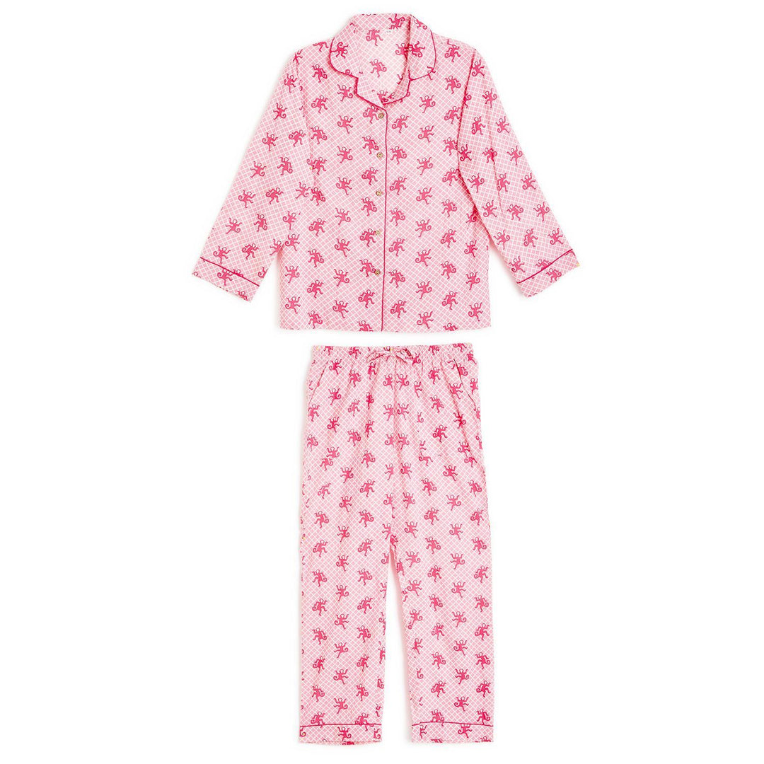 Pink two-piece cotton pajamas with red palm tree print, red piping, button-up top, pants. Sizes: S, M, L. Gift bag included.