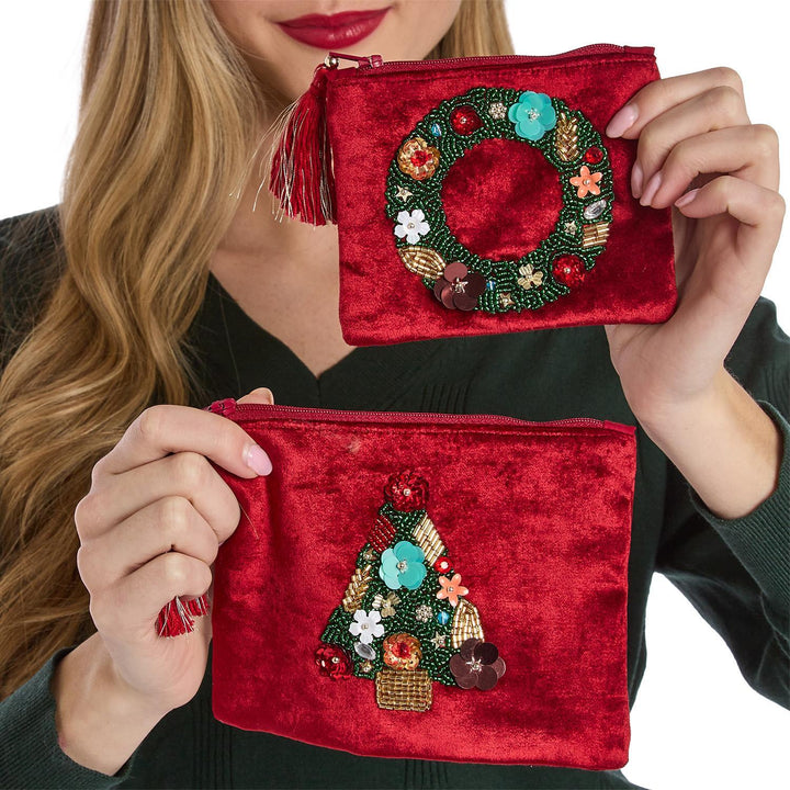 Two red velvet holiday pouches with beaded wreath and Christmas tree appliqués.