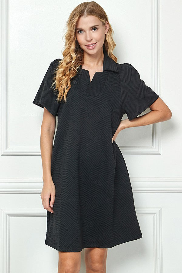Emilie Collared Textured Dress: short-sleeve, knee-length black dress. Available in sizes XS–XL.
