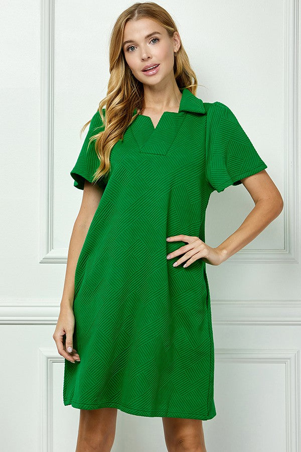 Emilie Collared Textured Dress: short-sleeved, knee-length green dress with geometric patterns. Available in sizes XS-XL.