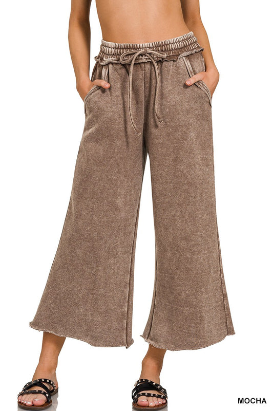 These Capri acid wash fleece sweatpants with two large pockets drawstring waist elastic waist band with flared bottoms