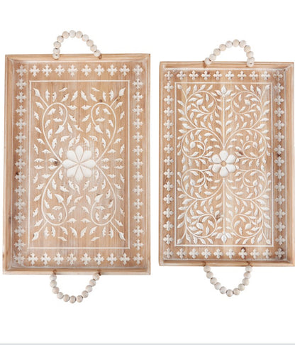 Set of two rectangular wooden trays with white floral patterns, beaded handles. Available in small and large sizes.