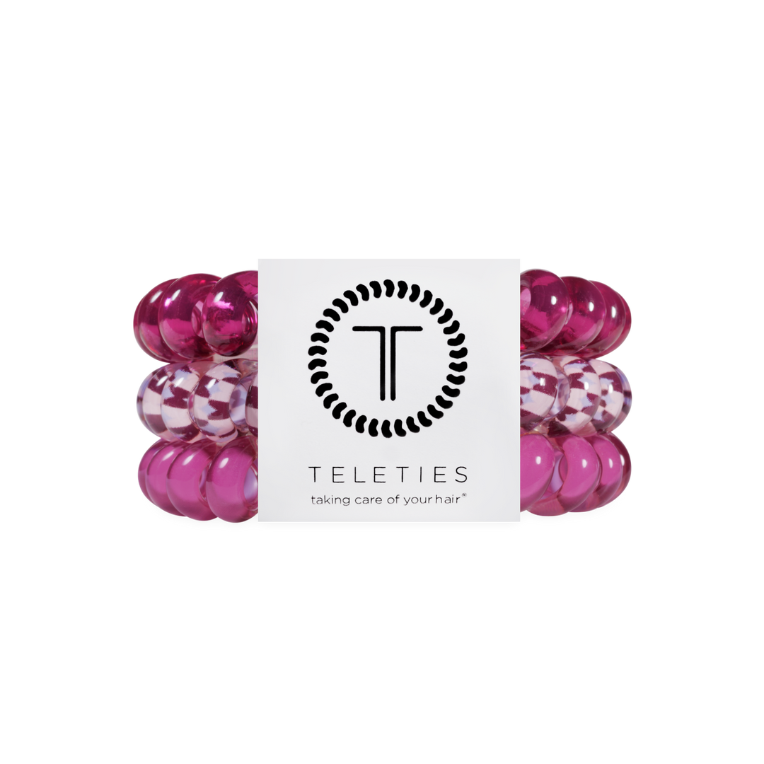 Three Merlot after Midnight Large Hair Ties in pink spiral coil design, including one checkered style, available in large size, provide a no-crease, gentle hold.