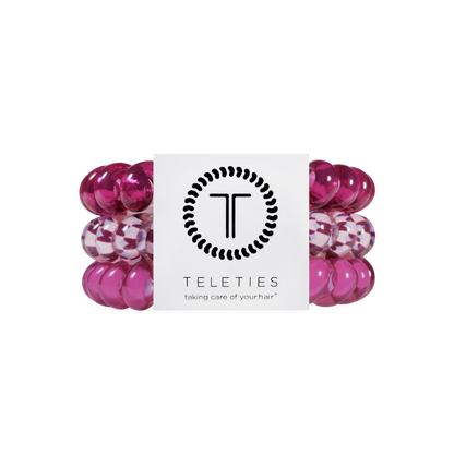 Three Merlot after Midnight Large Hair Ties in pink spiral coil design, including one checkered style, available in large size, provide a no-crease, gentle hold.