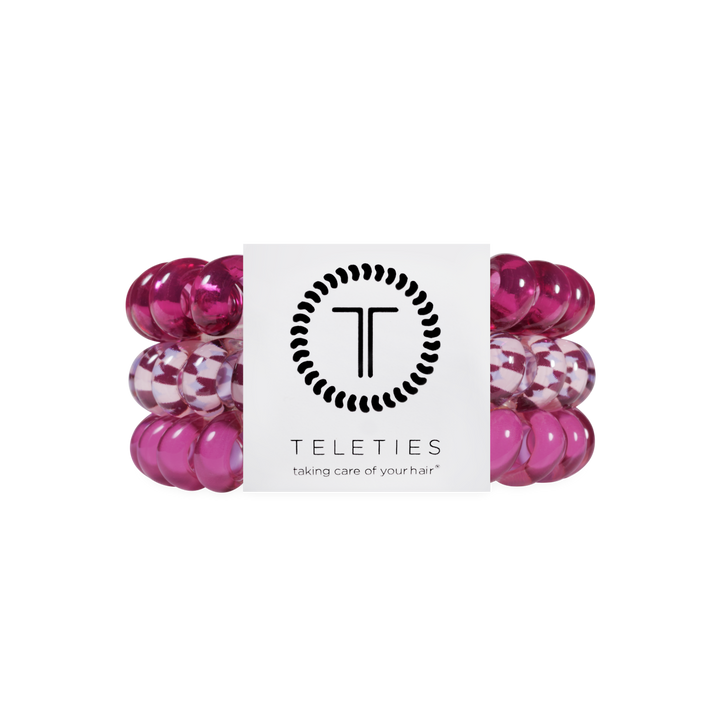 Three Merlot after Midnight Large Hair Ties in pink spiral coil design, including one checkered style, available in large size, provide a no-crease, gentle hold.