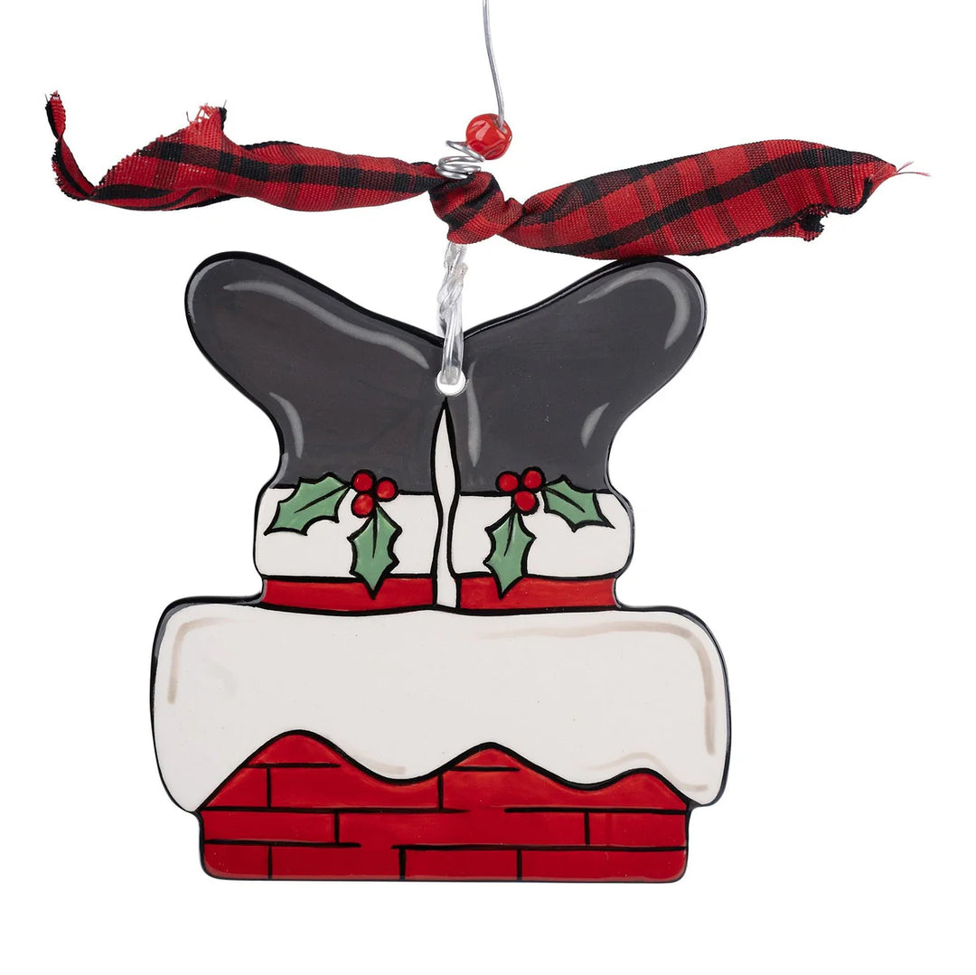 Santa Chimney Flat Ornament featuring hand-painted ceramic Santa boots in a brick chimney with red and black plaid ribbon.