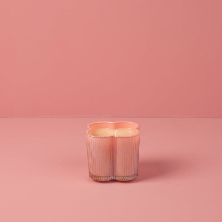 Sweet Grace Collection Flower Candle, 7.2 oz, pink ribbed clover-shaped glass holder, soy-blend wax, unlit.