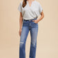 White, short-sleeved checkered blouse. Comfort Stretch Straight Leg Frayed Hem Jeans in blue. Sizes: 24, 25, 26, 27, 28.