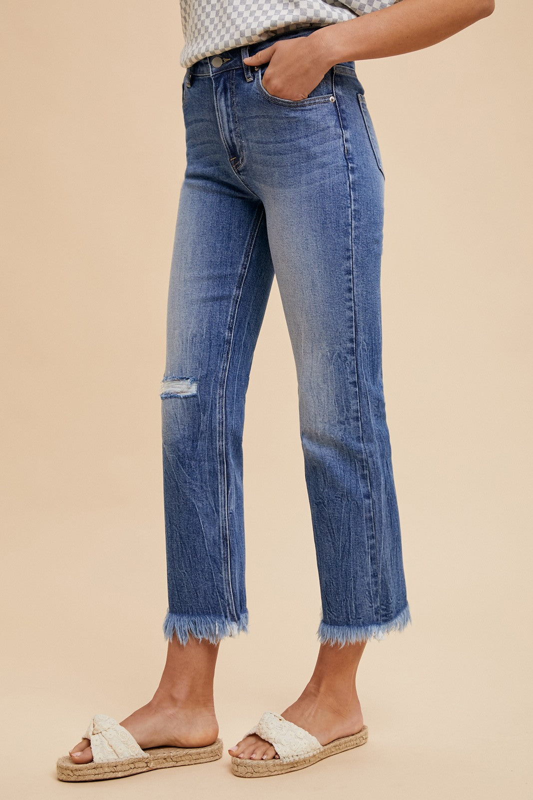 Comfort Stretch Straight Leg Frayed Hem Jeans in blue, featuring a small rip on one knee. Sizes available: 24-32.