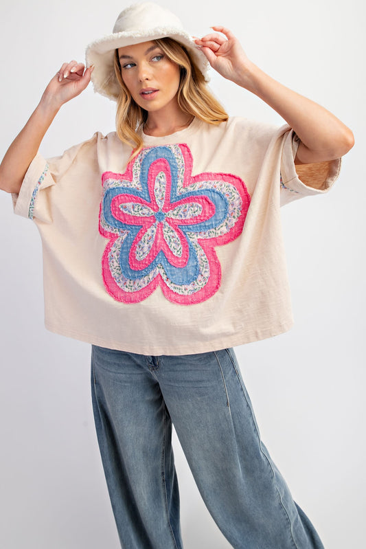 Beige Flower Patch Washed Cotton Slub Top with a large, colorful floral design in pink, blue, and purple. Sizes available: S, M, L, XL.