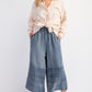 Light beige shirt with subtle patterns, tied at the waist. Mineral Washed Chambray Wide Leg Capri Pants with hem embroidery, sizes S/M/L. Paired with light-colored sneakers.