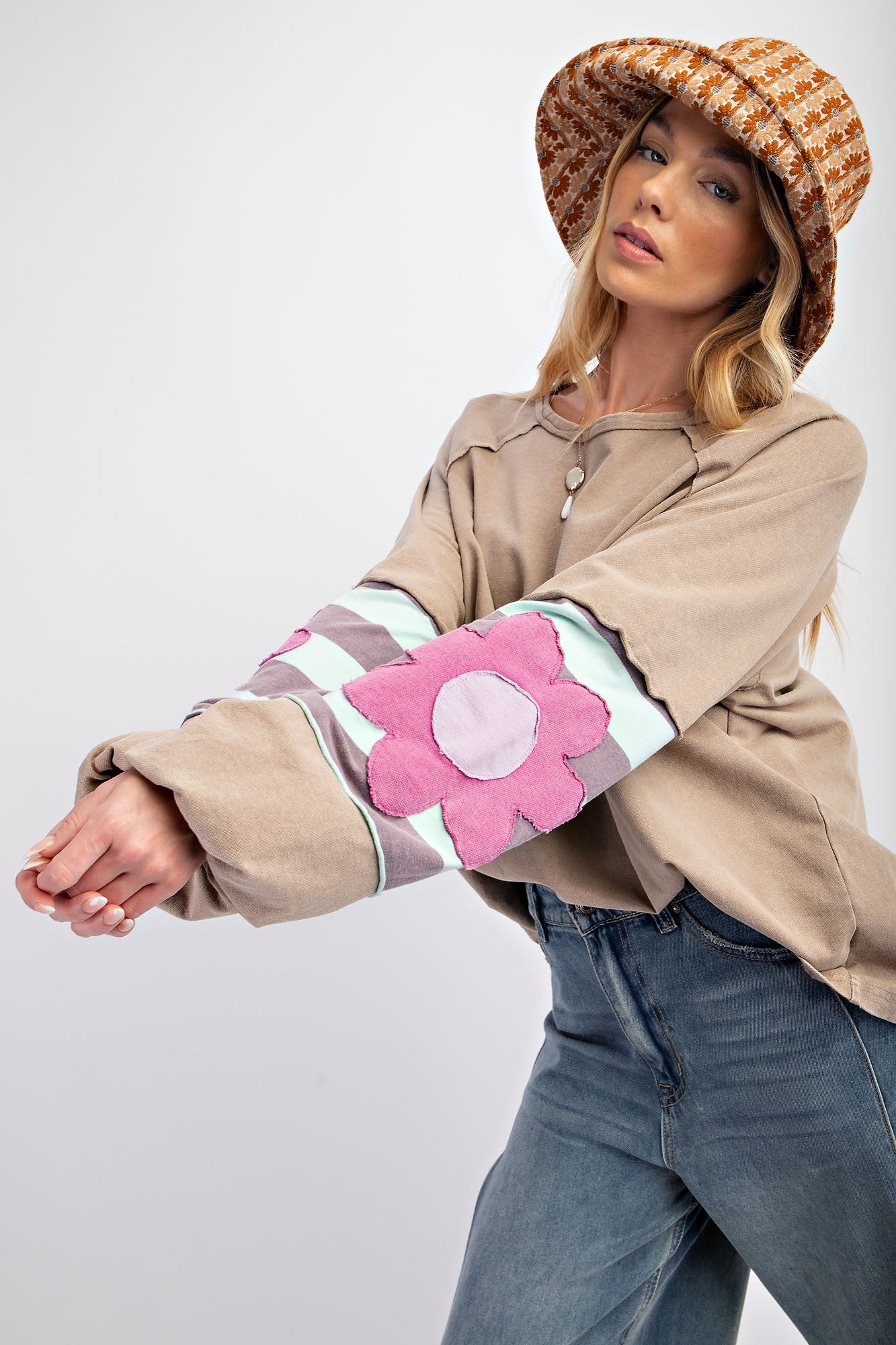 Flower Patch Terry Knit Washed Pullover: Features large pink flower patches on sleeves. Sizes available: S, M, L, XL.