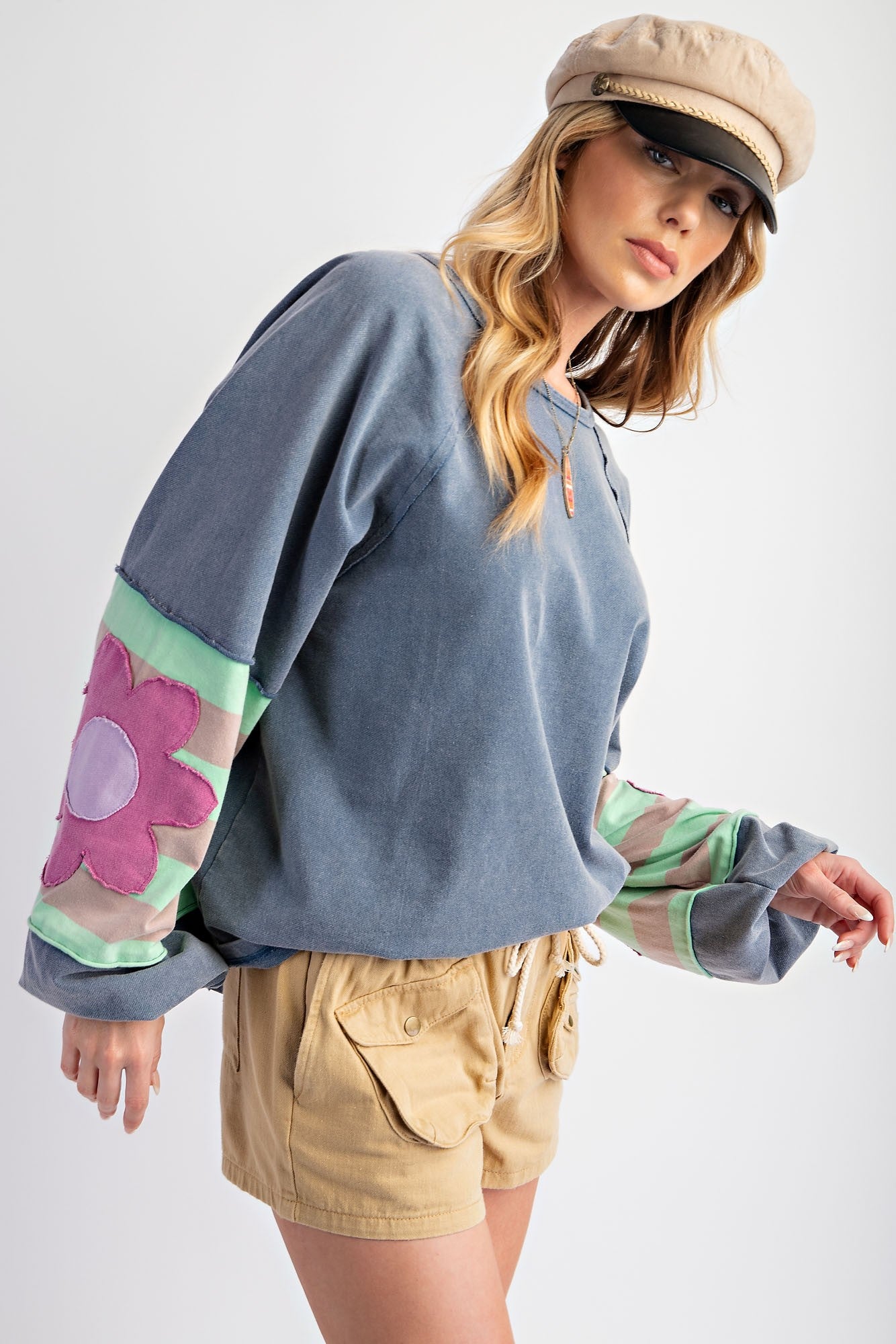 Flower Patch Terry Knit Washed Pullover: A soft, vintage-look top featuring a floral patch design. Available in sizes XS, S, M, L, XL.