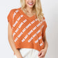 Horns Burnt Orange Sweater Vest with “GAME DAY” text. Available in sizes S-XL.