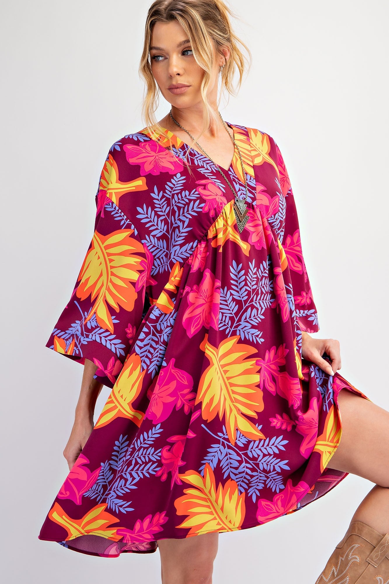 The Printed Sophia Twill Woven Dress features bold floral patterns in pink, yellow, and blue. Available sizes: XS, S, M, L, XL.