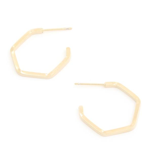 Two 14K Gold Dipped Hypoallergenic Hexagon Hoops with a minimalist design. Available in one size.